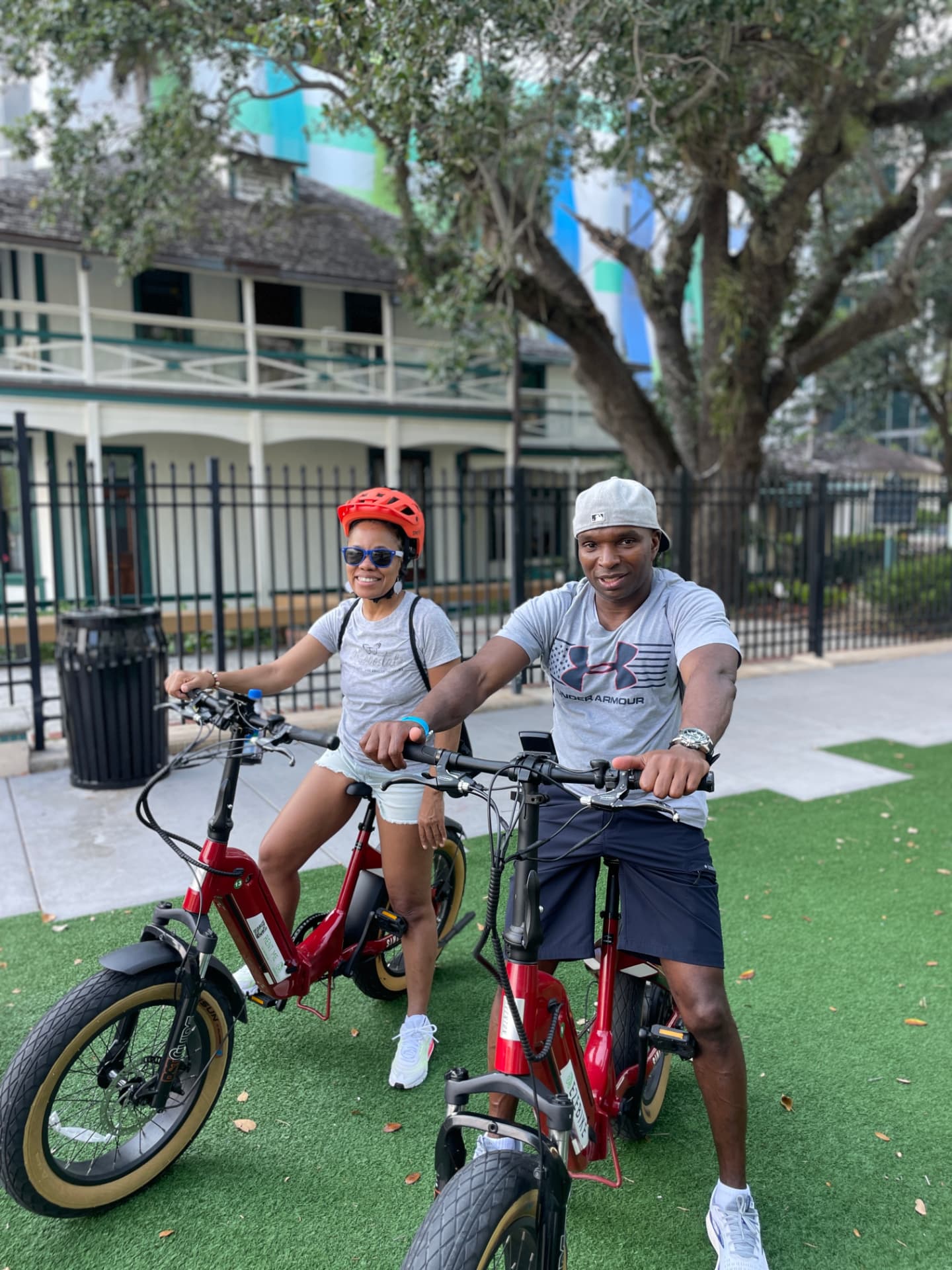 Couple riding red Aventon eBike rentals through downtown Fort Lauderdale