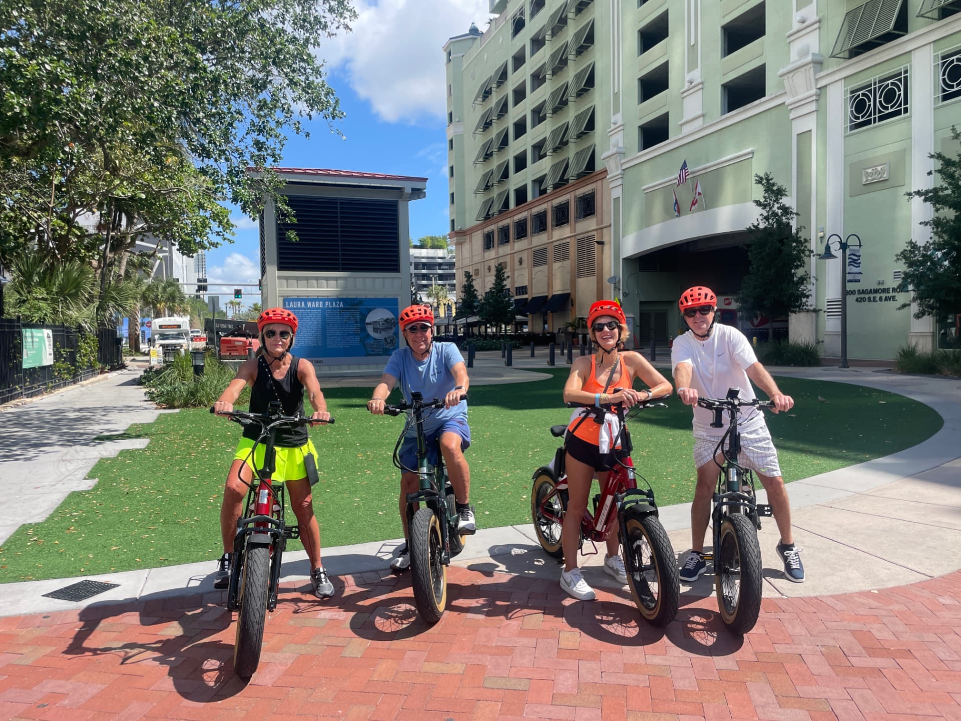 Four friends on eBike rentals at Laura Ward Plaza in Fort Lauderdale