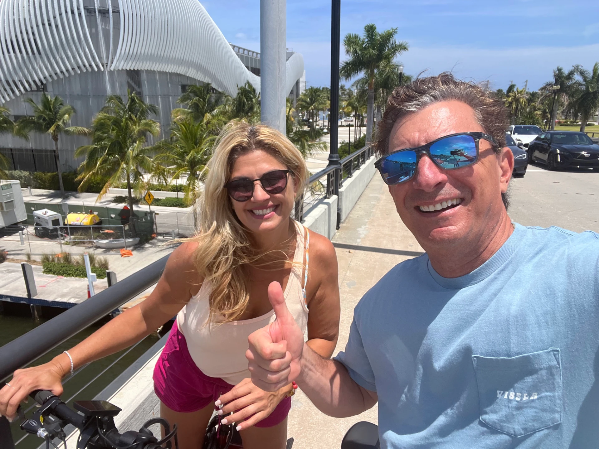 Happy EzeBike customers giving a thumbs-up on a Fort Lauderdale eBike tour